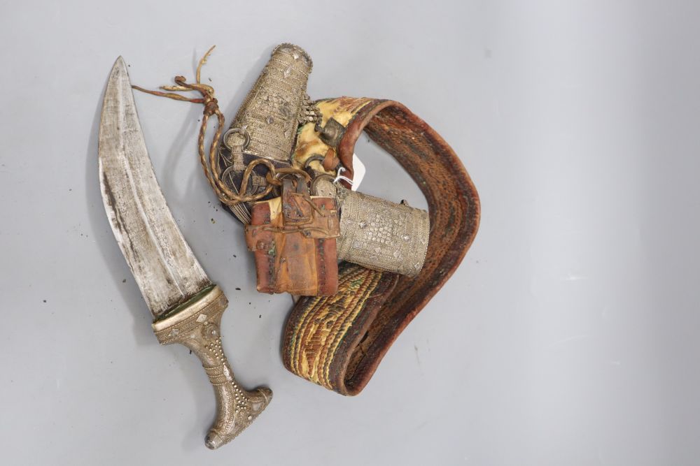 A silver-mounted Arab dagger jambiya with woven leather belt, length 30cm
